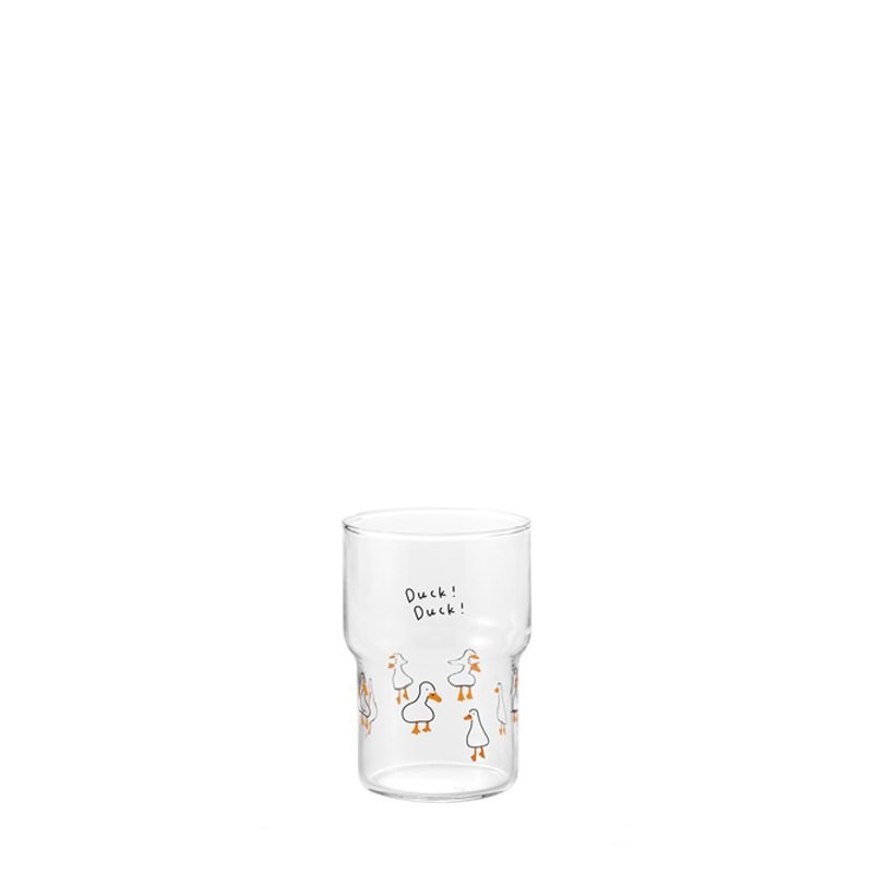 This is a product photo featuring a pure white background, taken in the standard B2B e-commerce style, to promote Xinghuo Glass's cute cartoon duck-printed transparent coffee glass. In the center of the pristine white background, a simple, completely tran