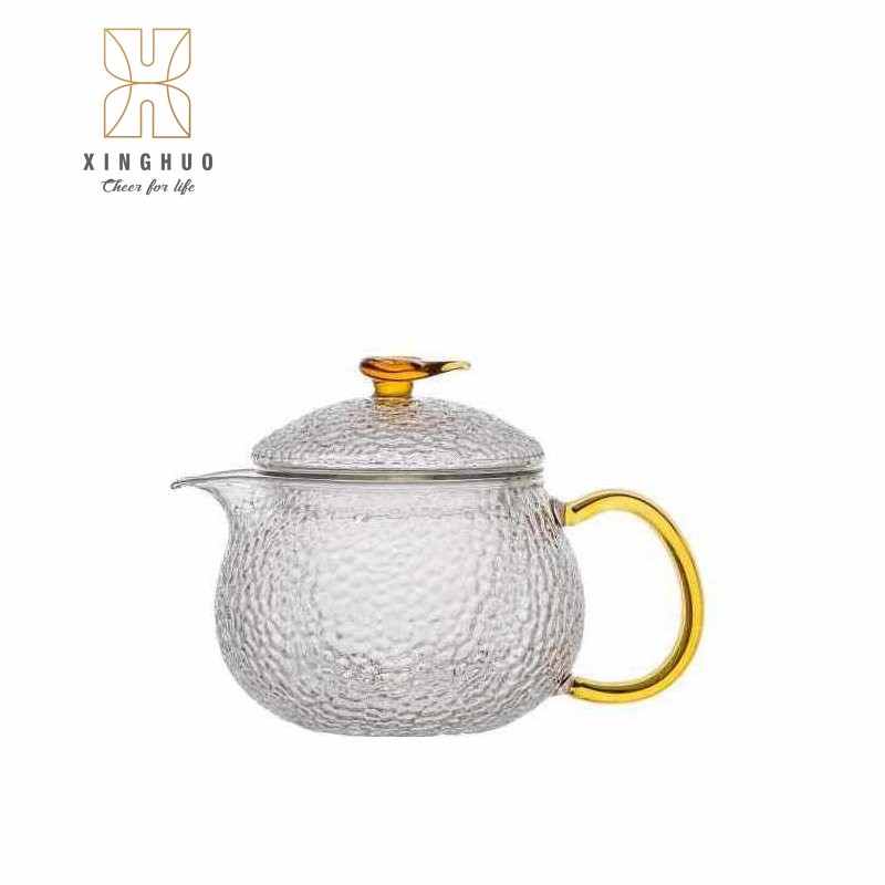 Xinghuo Glass tea cup with gold handle and hammered texture - product image