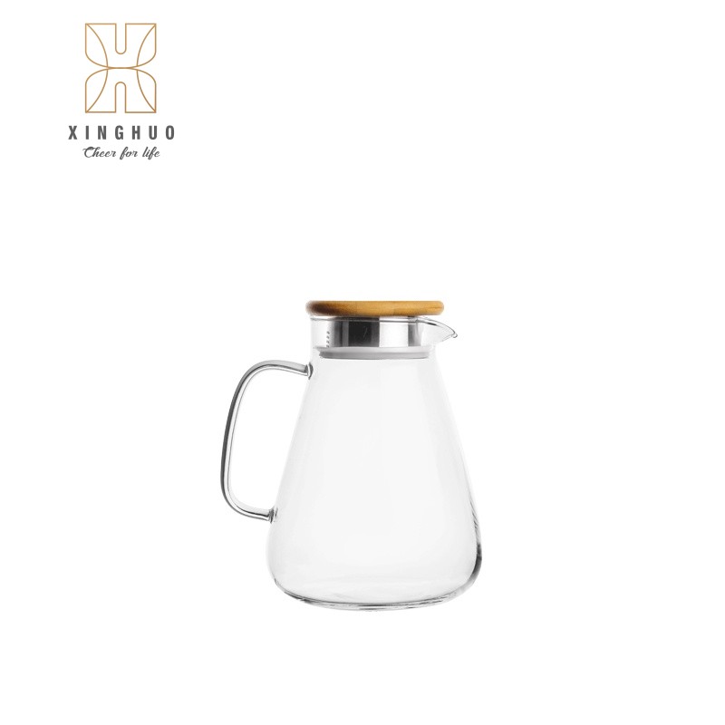 Image of a transparent cone-shaped heat-resistant glass pitcher with a bamboo lid.
